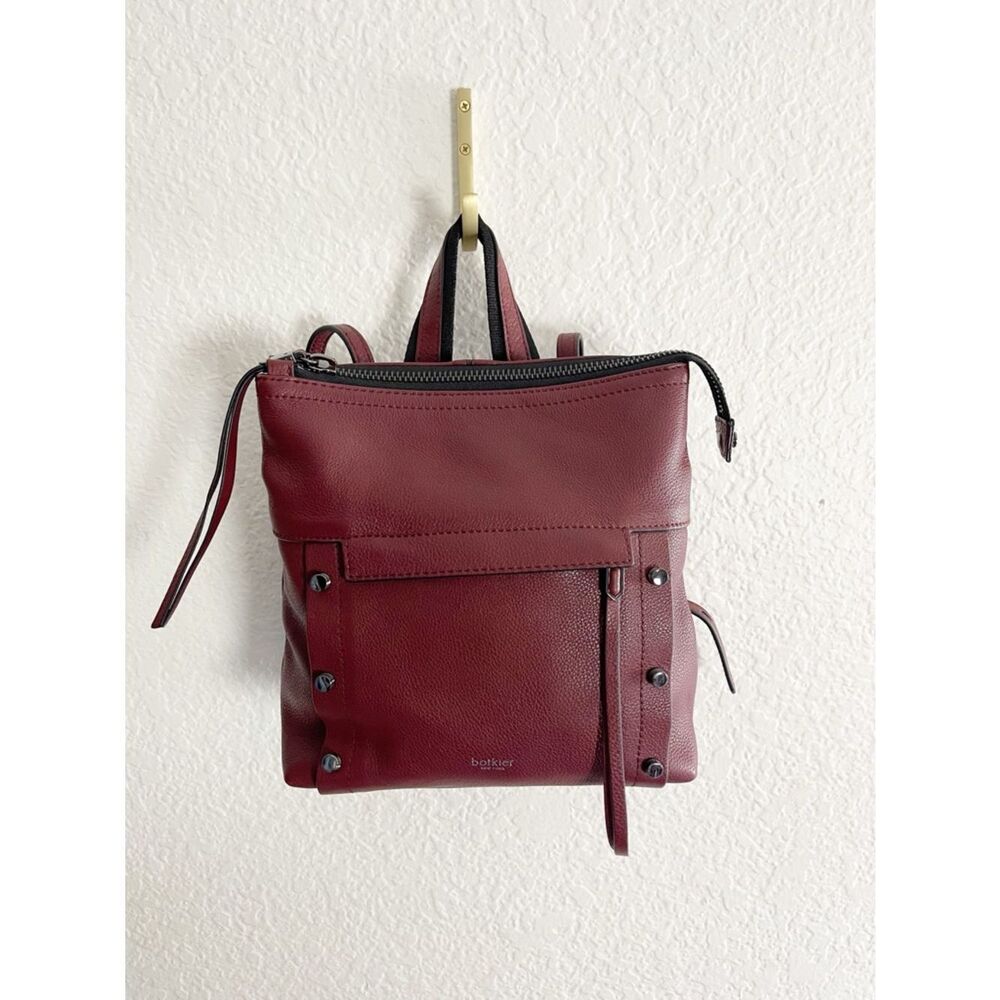 Botkier Noho Studded Leather Backpack in a rich burgundy merlot shade.